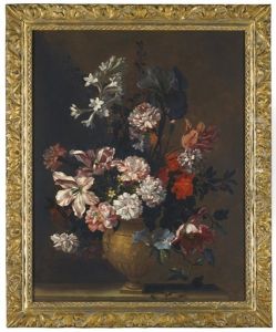 Still Life Of Variegated Tulips, Carnations, An Iris And Other Assorted Flowers Arranged In A Vase On A Stone Ledge by Jean-Baptiste Monnoyer