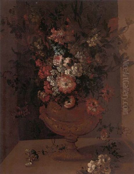 Carnations, Roses, Bluebells, Narcissi And Other Flowers In A Gift Urn On A Ledge - view 1