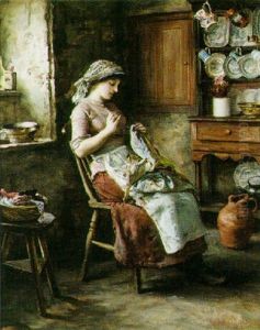 Young Woman Making A Quilt