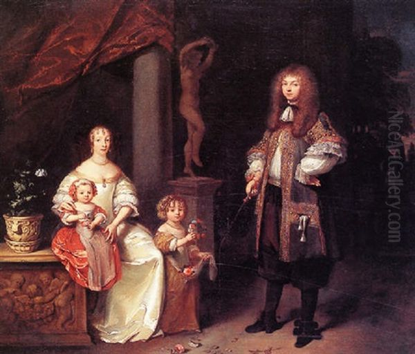 Portrait Of A Couple With Their Two Children In A Garden - view 1
