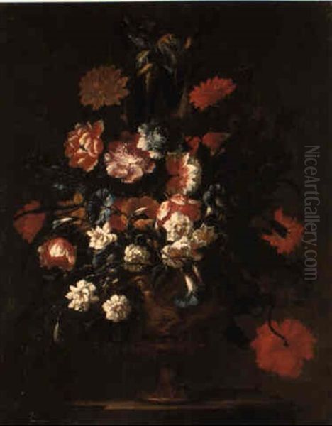 Poppies, Irises, Carnations And Other Flowers In A Terracotta Vase On A Ledge - view 1