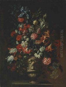 Carnations, Lilies, Tulips, Irises And Other Flowers In A Sculpted Vas On A Stone Plinth