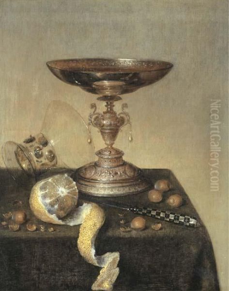 A Silver Tazza, An Upturned Roemer, A Partly-peeled Lemon, A Knifeand Hazelnuts On A Draped Table - view 1