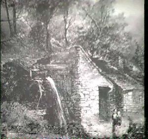 Rustic Family By A Mill And Pond