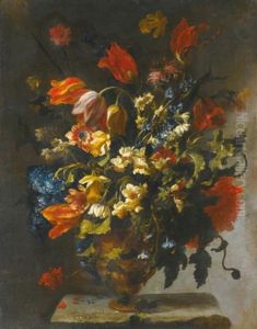 A Still Life With Narcissi, Daffodils, Clematis, Tulips, Carnations And Other Flowers In An Ornamental Vase On A Stone Ledge