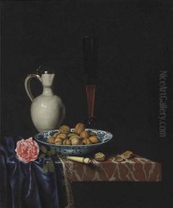A Wan-li Bowl With Walnuts, A Facon De Venise Wine Glass, An Ivory-handled Knife, A Delft Stoneware Jug And A Rose On A Partially Draped Marble Ledge by Hubert van Ravesteyn