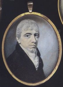 A Gentleman Wearing Dark Brown Coat With Black Collar, White Waistcoat And Stock