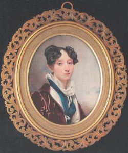 A Lady Wearing Crimson Velvet Coat Over Blue Dress With High Collar, Her Dark Brown Hair Curled And Secured In A Top-knot