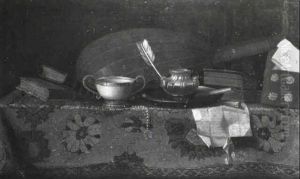 Still Life Of A Lute With Books, Letters And A Cup Upon A   Table Draped With A Carpet