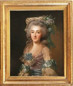 Portrait D'une Jeune Femme Au Chapeau Fleuri Et Aux Rubans Bleus