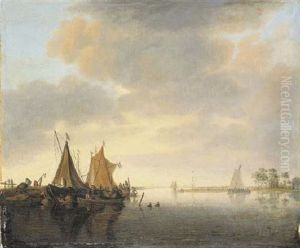 An Estuary Landscape With Sailing Vessels Moored At A Jetty In A Calm