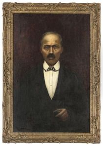 Portrait Of A Gentleman In A Black Suit, White Shirt And Chequered Bow Tie