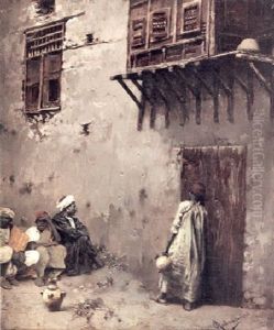 A North African Building Front With A Figure On A Door And Others Seated On The Ground by Rubens Santoro