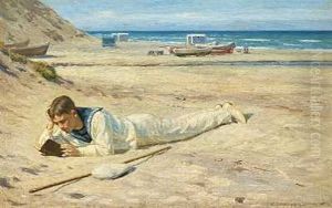 En Dreng I Matrostoj Ligger Og Laeser Pa Stranden En Dreng I Matrostoj Ligger Og Laeser Pa Stranden
