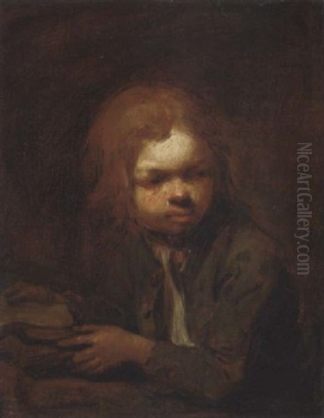 A Young Boy Seated At A Table With Books - view 1