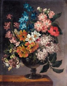 A Still Life Of Bluebells, Poppies, And Other Flowers In A Vase On A Ledge