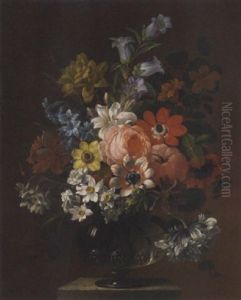 Narcissi, Tulips, Carnations, Delphiniums And Nasturtiums In A Goblet On A Ledge by James Sillett