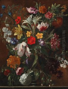 Mixed Flowers In A Vase On A Ledge