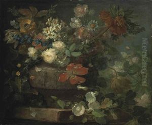 Red And White Roses, Tulips, Blossom And Other Flowers, In A Sculpted Vase, On A Stone Ledge by Ludovico Stern