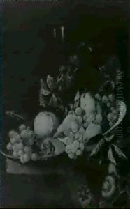 A Still Life Of Fruit And A Glass Of Wine Arranged On A Table Draped With A Rug by Hendrick van Streeck
