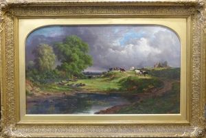 Cattle Grazing In A River Landscape