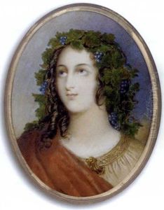 A Young Lady Dressed As A Bacchante, In Pale Brown Dress With Gold Embroidered Border And Scalloped Shaped Gold Brooch, Red Cloak Draped Over Her Right Shoulder ... A Young Lady Dressed As A Bacchante, In Pale Brown Dress With Gold Embroidered Border And Scalloped Shaped Gold Brooch, Red Cloak Draped Over Her Right Shoulder ...