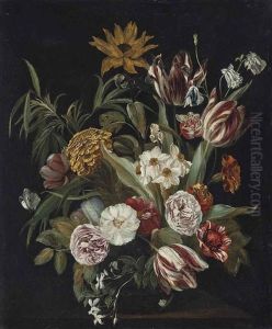Roses, Tulips, A Sunflower And Other Flowers In A Glass Vase On A Stone Ledge