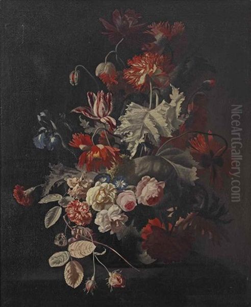 Dalias, Tulips, Blue Irises And Other Flowers In A Glass Vase On A Stone Ledge - view 1