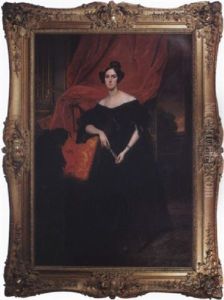 Portrait Of A Woman Wearing A Black Satin And Lace Gown Against A Red Velvet Curtain, Distant Landscape
