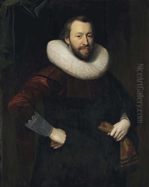 Portrait Of A Gentleman, Three-quarter-length, In A Red And Black Costume With A Lace Collar, Holding A Pair Of Gloves In His Left Hand - view 1
