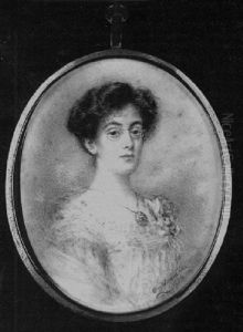 A Lady, Wearing Spectacles, Low-cut Cream Dress And Mauve Shawl About Her Shoulders