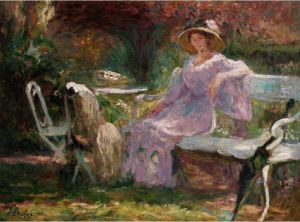 Woman Seated On A Bench In A Garden