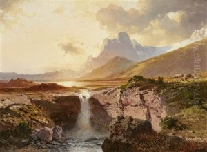 A Mountain Lake With A Waterfall At Sunset