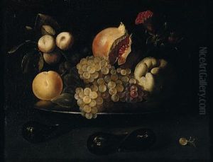 Still Life Of Grapes, Pomegranates, Apples, Peaches, Plums And Figs On A Silver Dish, Together With Figs And A White Grape Arranged Upon A Table Top by Juan de Zurbaran