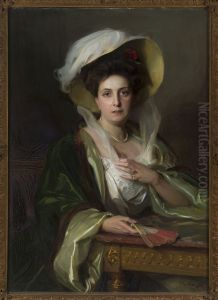 Portrait of a lady in a large hat by Philip de Laszlo