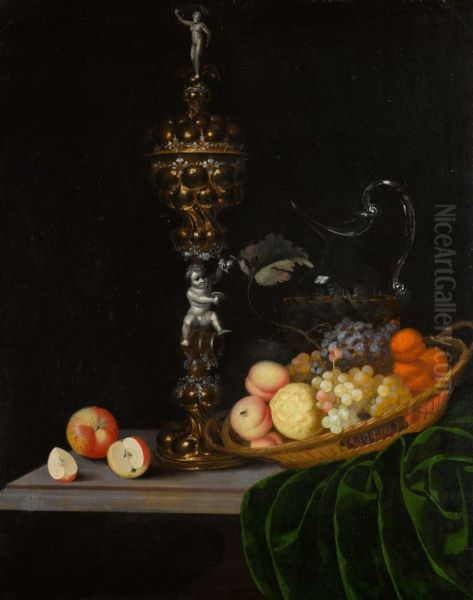 Still life with an elaborate silver gilt standing cup, a basket of fruit, and a glass wine jug upon a partly draped table - view 1
