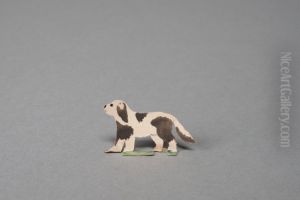 White dog with black spots looking up [one of 36 figures]