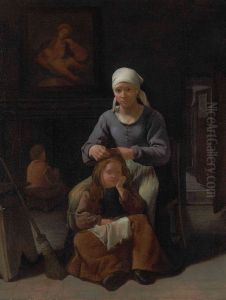 Woman in an interior delousing a child