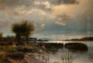 An extensive view of a lake with a boy fishing in the foreground An extensive view of a lake with a boy fishing in the foreground