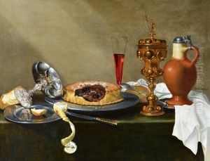 A still life with a silver tazza, a pie, a peeled lemon, a flute glass, a goblet and an earthenware jug on a draped table A still life with a silver tazza, a pie, a peeled lemon, a flute glass, a goblet and an earthenware jug on a draped table