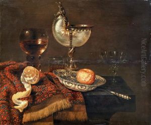 A clementine in a porcelain bowl, a nautilus cup, a roemer, two glasses, a knife, a peeled lemon on an ornamental carpet on a table by Willem Claesz. Heda