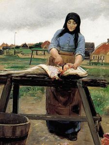 A woman from Skagen cutting a haddock. A woman from Skagen cutting a haddock.