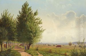 Summer landscape with cows grazing and an avenue.