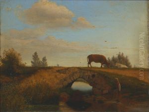 A boy standing at a river with cows in the background. A boy standing at a river with cows in the background.