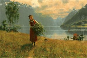 Junges Madchen mit Birkenzweigen vor einem norwegischen Fjord. by Hans Dahl