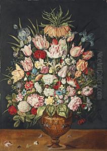 Tulips, roses, a chrysanthemum and other flowers in a sculpted bronze urn