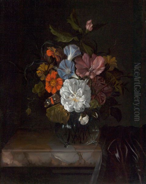 Flowers in a glass vase on a partly draped marble ledge - view 1