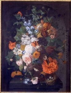 Flowers on a stone ledge with a bird's nest