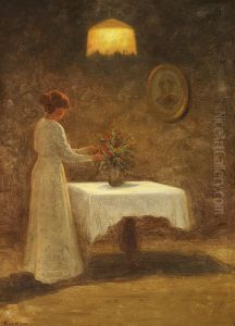 Interior with a woman arranging a bouquet of red flowers on a table.