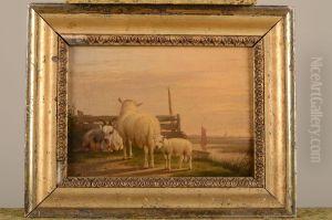 Geit, schaap en een lam bij een hek